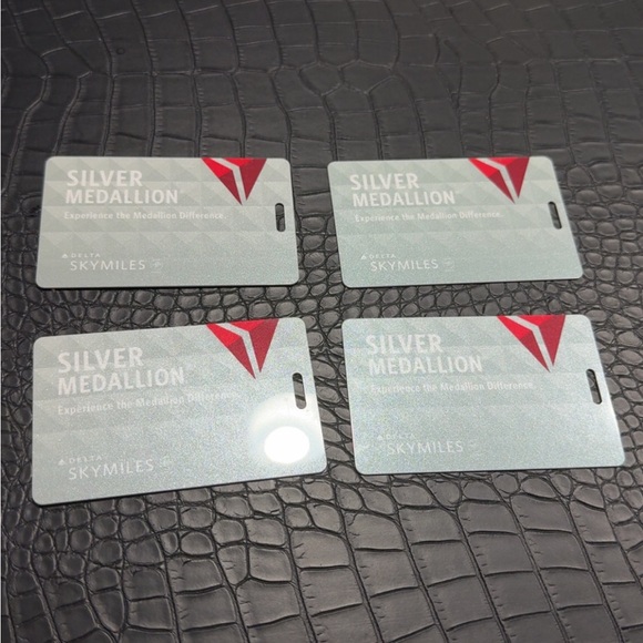 4 Brand New Delta Silver Medallion Tags with Red Accents - Picture 1 of 3